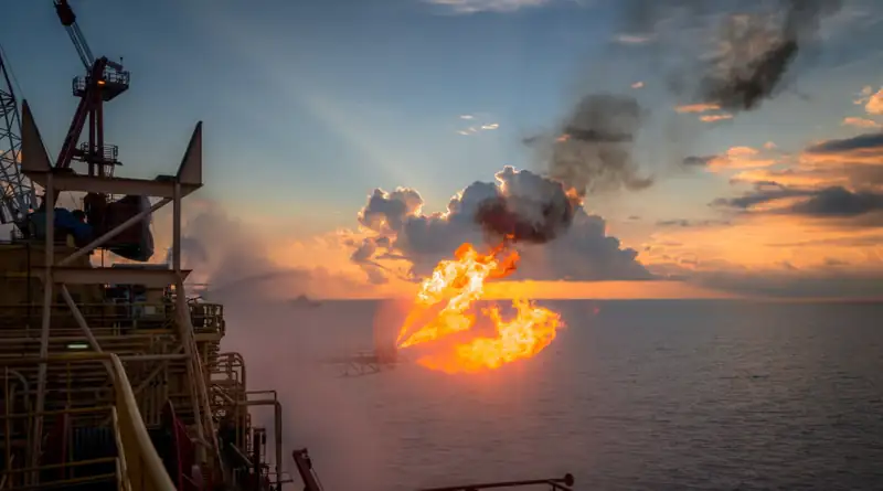 Offshore well test flare at sunset